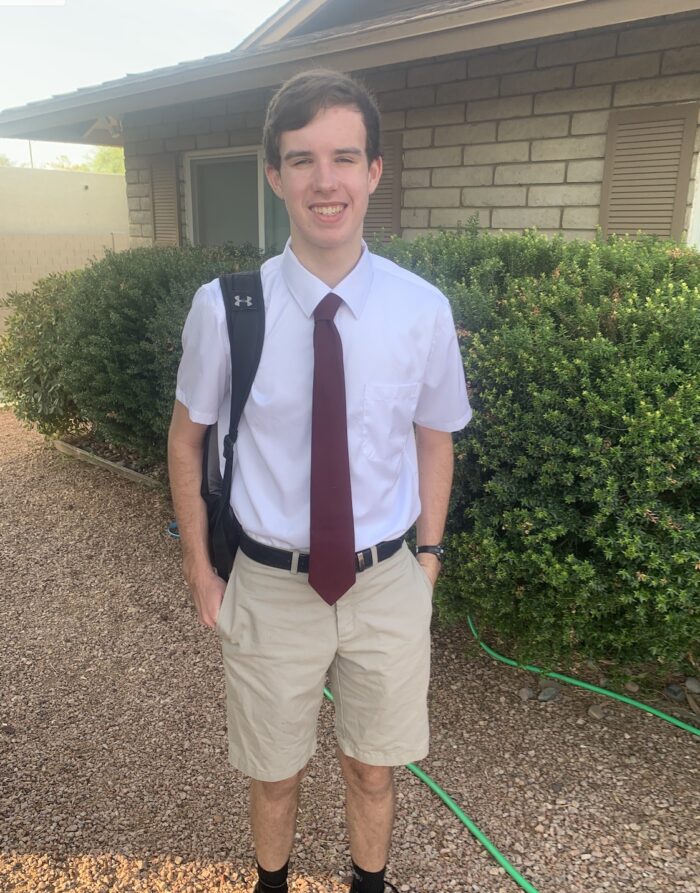 Student with uniform and backpack