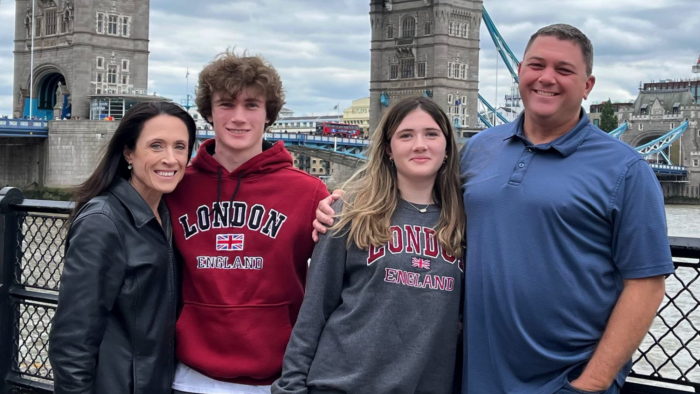 A family of four in front of the London Bridge