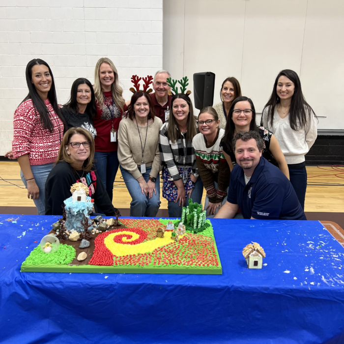 Faculty team standing with their gingerbread structure