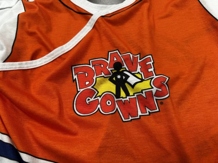 "Brave Gowns" logo on a hospital gown