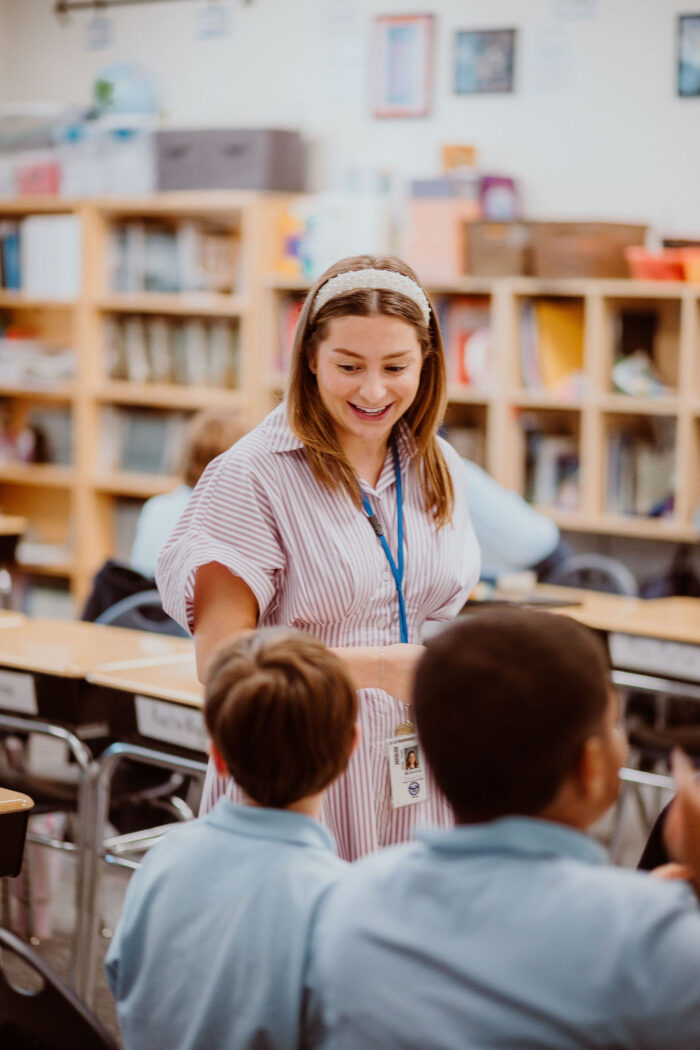 A teacher with two students.