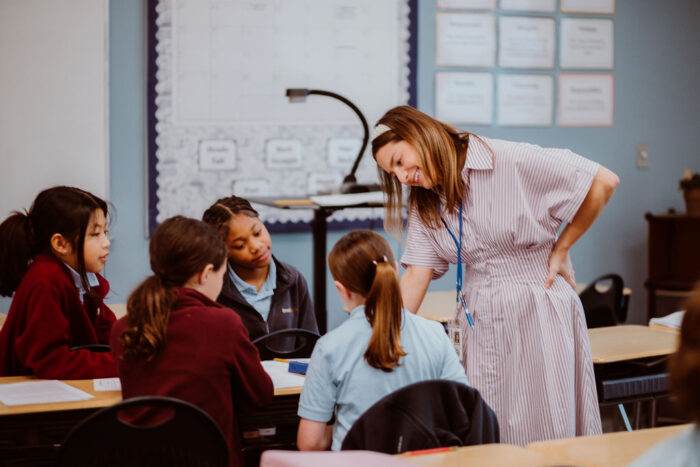 A teacher with four students