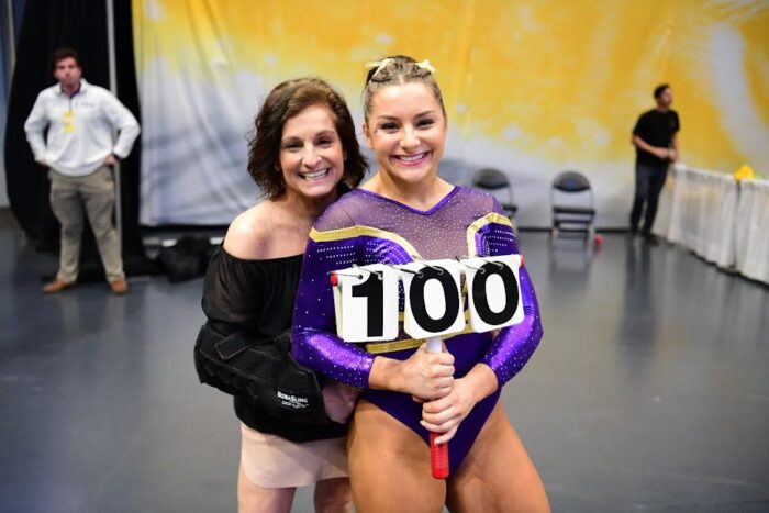 A young gymnast with her mother.