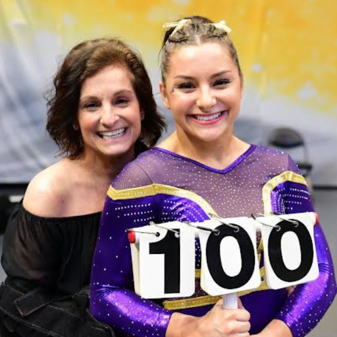 A young gymnast with her mother.