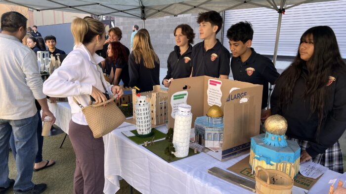 Students displaying their architectural projects.